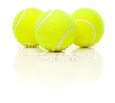 Three Tennis Balls on White with Slight Reflection