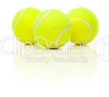 Three Tennis Balls on White with Slight Reflection