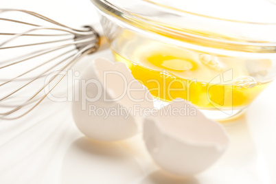 Hand Mixer with Eggs in Glass Bowl