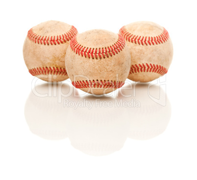 Three Baseballs Isolated on Reflective White