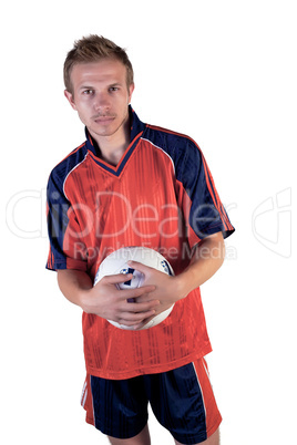 Football player posing with ball in hands on a white background