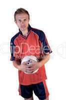 Football player posing with ball in hands on a white background