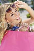 Beautiful Happy Blond Woman With Shopping Bags