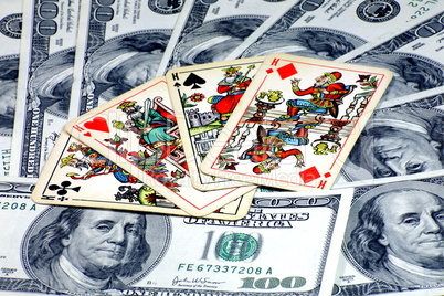 american dollars with playing cards