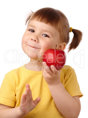 Cute child is going to bite an apple