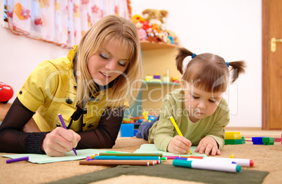 Teacher with child in preschool