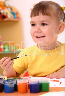 Child play with paints in preschool