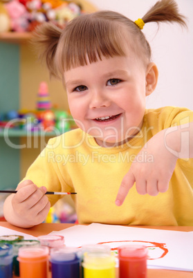 Child play with paints in preschool