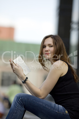 Woman read book and look at you