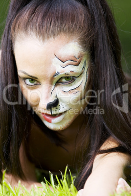 Woman with tigress face art portrait