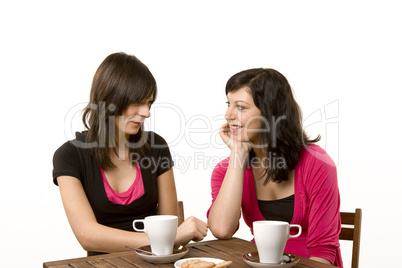 Young women at a cafe talking