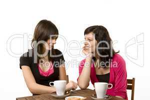 Young women at a cafe talking