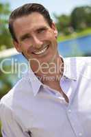 Outdoor Portrait of Handsome Smiling Middle Aged Man