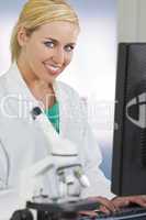 Female Scientist or Doctor Using Computer In Laboratory