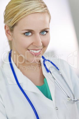 Attractive Smiling Blond Woman Doctor With Stethoscope