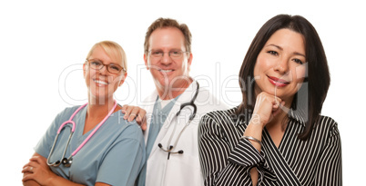 Hispanic Woman with Male Doctor and Nurse