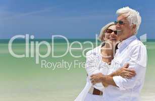 Happy Senior Couple Looking To Sea on A Tropical Beach