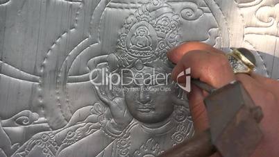 Thai sculptor makes traditional Buddhist art.