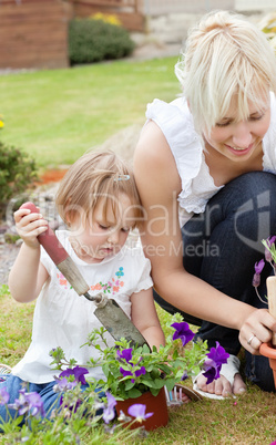 Little girl with purple flowers