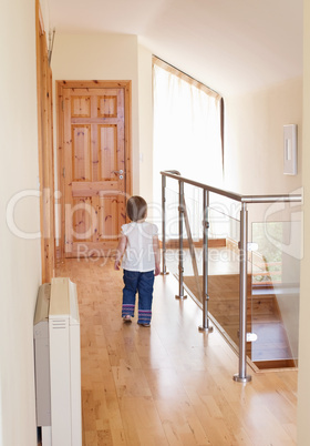 Little girl wakling  on the floor