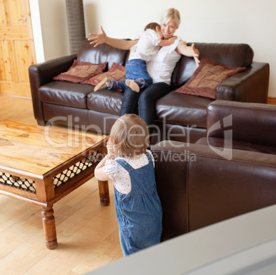 Little girl looking to her mother