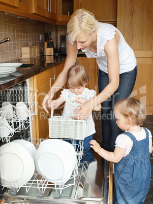 Family put dishes in the dishwasher