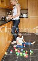 Little girl sitting in the kitchen