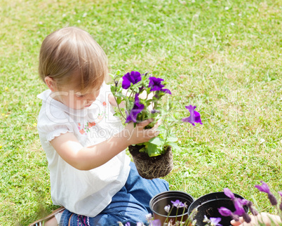 Child holding a flower