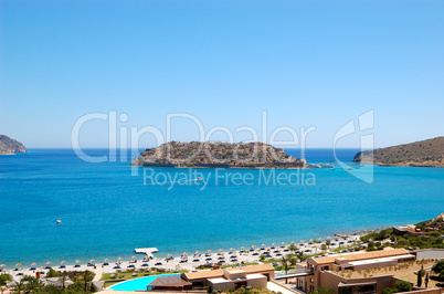 Beach of luxury hotel  with a view on Spinalonga Island, Crete,