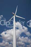 Wind power station against the sky with clouds