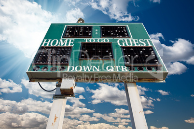 HIgh School Scoreboard Over Blue Sky with Clouds