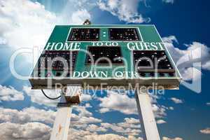 HIgh School Scoreboard Over Blue Sky with Clouds