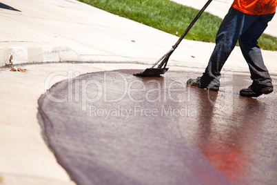 Worker Resurfacing Street