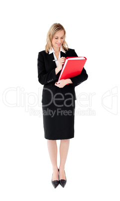 Radiant businesswoman writing on a paper