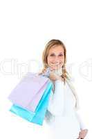 Handsome woman holding shopping bags