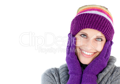 Smiling woman holding her head in her hands