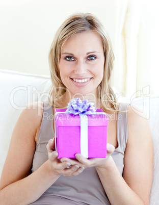 Handsome woman holding a present