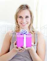 Handsome woman holding a present