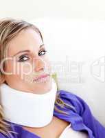 Young woman with a neck brace looking in the camera