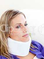 Unhappy woman with a neck brace