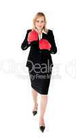 Ambitious businesswoman boxing