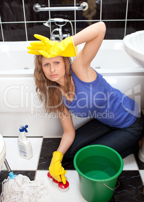 Exhausted woman in a bathroom