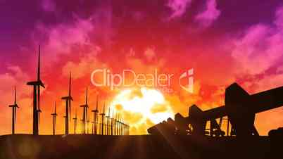 Wind turbines and oil pumps at sunset