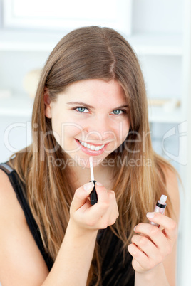 Portrait of a beautiful woman use gloss