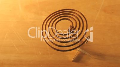 Time lapse mosquito coil burning away