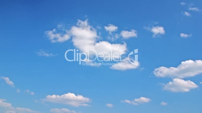 White clouds flying on blue sky - motion background time-lapse