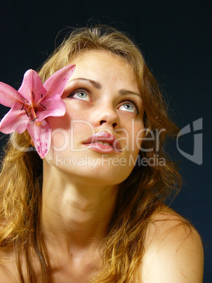 girl with a lily  in hairs