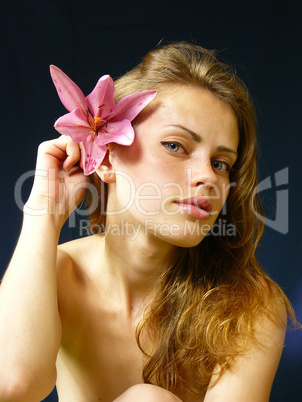 woman with a lily  in hairs