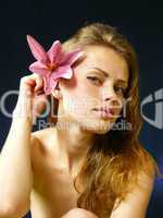 woman with a lily  in hairs