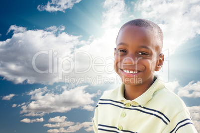 Young African American Boy with Clouds and Sky